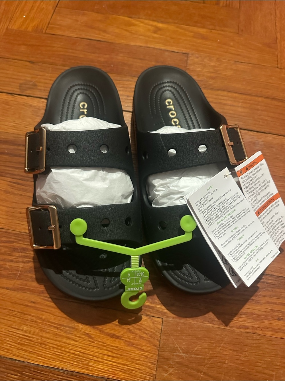 CROCS Black Slide Sandals with Rose Gold Buckles